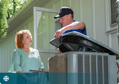 Cooling CTA Cooling services: Academy Air technician opening an outdoor air conditioner while the homeowner watches