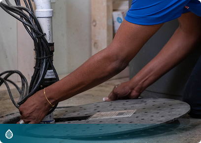 Drains CTA Drain services: Academy Air technician opening a basement floor drain